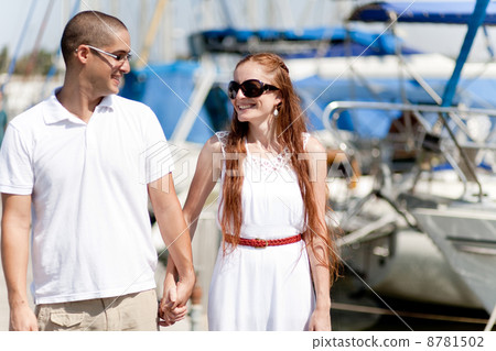 Couple holding their hands each other,harbour view Couple holding their hands each other,harbour view 8781502