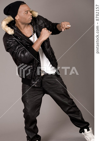 Young beautiful black man dances Young beautiful black man dances 8782157