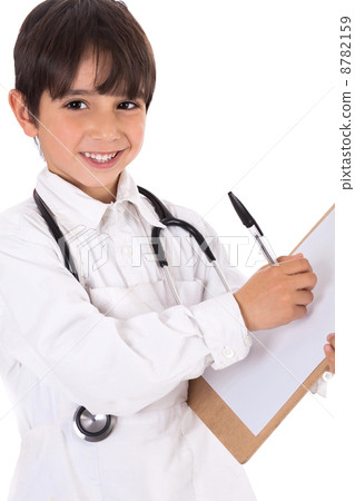 Little boy doctor writes on his clipboard for diagnosis 8782159
