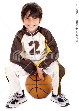 Kid stylishly sitting on the ball Kid stylishly sitting on the ball 8782196