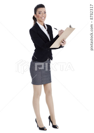 Full length of business woman writing in pad Full length of business woman writing in pad 8782317