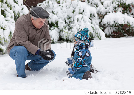 Grandfather and toddler boy  on winter day 8782849
