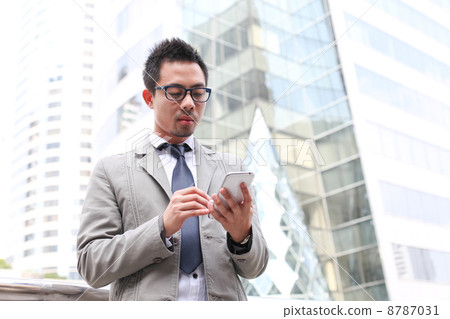 Asian Business Man With A Tablet Computer 8787031
