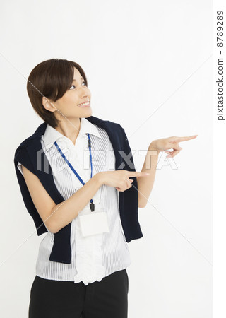 A woman pointing to the right with both hands 8789289