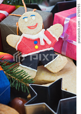 smiling on the background of Christmas gingerbread decorations 8789765