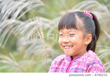 A girl playing with Suzuki 8790232