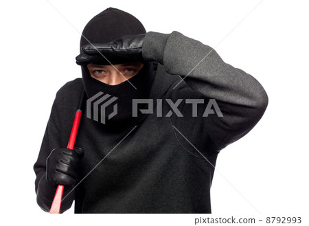 Burglar with a crowbar on the shoulder. 8792993