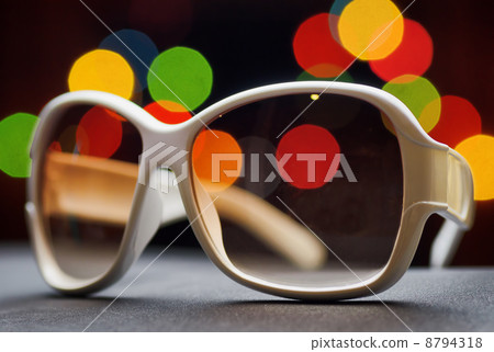 White plastic sunglasses. Funny bokeh 8794318