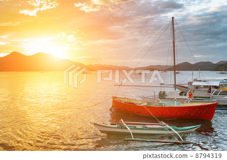 Traditional boats at sunset. Philippines 8794319