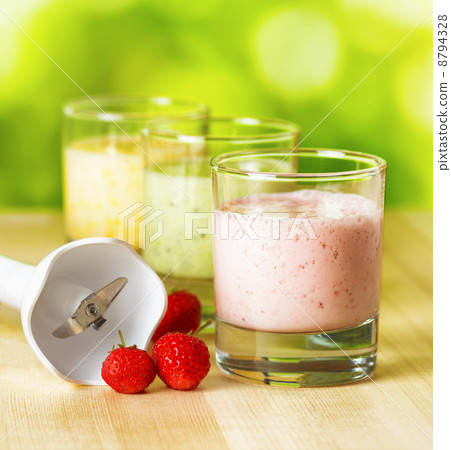 Fruit smoothie on wooden table on narural background Fruit smoothie on wooden table on narural background 8794328