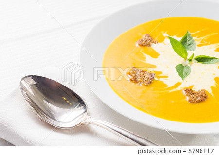 Pumpkin soup on served table Pumpkin soup on served table 8796117