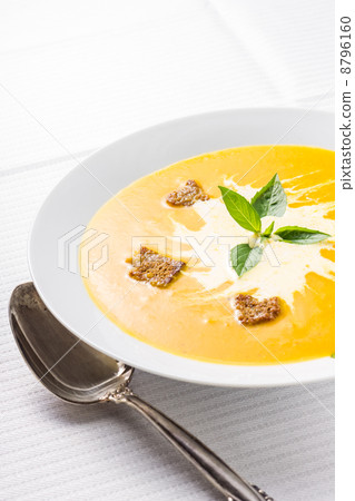 Pumpkin soup on served table Pumpkin soup on served table 8796160
