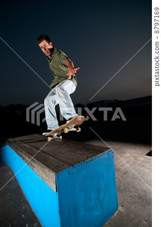 Skateboarder on a grind 8797169
