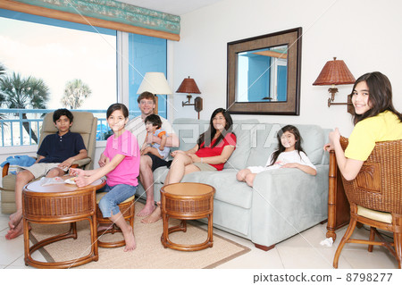 Family relaxing in living room Family relaxing in living room 8798277