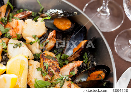 seafood paella in the fry pan seafood paella in the fry pan 8804238