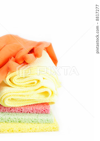 Rubber gloves and a cleaning sponges on a white background. Rubber gloves and a cleaning sponges on a white background. 8817277