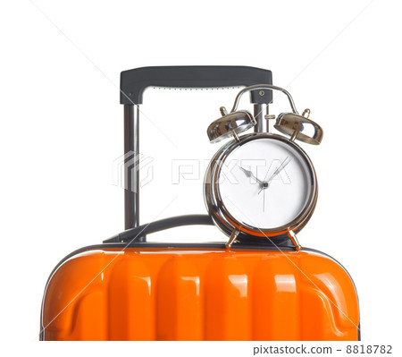 Alarm clock on orange suitcase 8818782