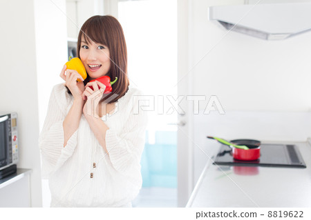 A woman relaxing in the kitchen 8819622