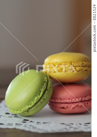 Stacked colorful macarons on lace paper Stacked colorful macarons on lace paper 8821524