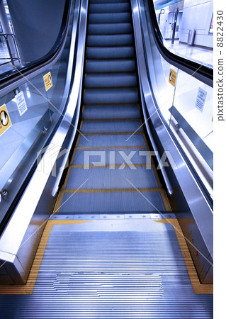 Moving escalator in a subway station 8822430