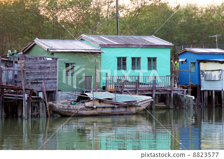 Wooden houses along the river Wooden houses along the river 8823577