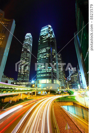 Traffic in city at night, it shows the busy business environment 8823579