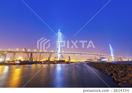 Hong Kong bridge at cargo terminal at night Hong Kong bridge at cargo terminal at night 8824354