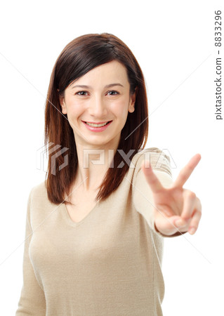 White woman giving a peace sign White woman giving a peace sign 8833296