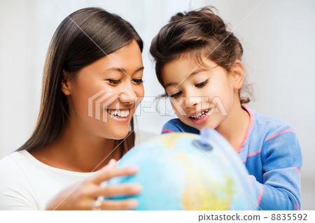 mother and daughter with globe 8835592
