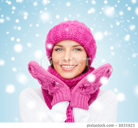 woman in hat, muffler and mittens 8835923