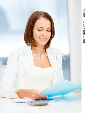 businesswoman working with graphs in office 8836292