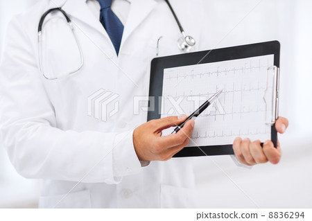 male doctor hands holding cardiogram male doctor hands holding cardiogram 8836294