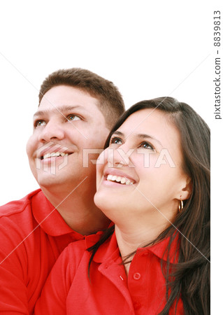 Young loving couple looking up to the sky, standing over white, 8839813