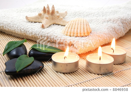 foldet white bath towel and zen stones 8846938