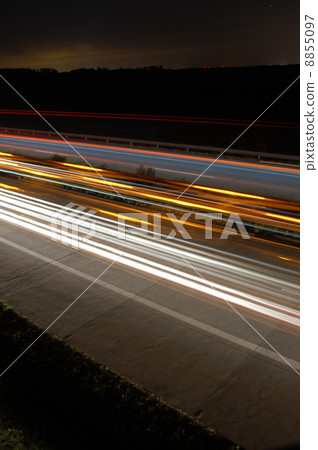 highway at night with traffic 8855097