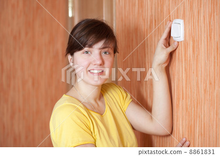 woman turning off the light-switch 8861831