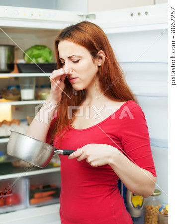 woman in red with foul food 8862257
