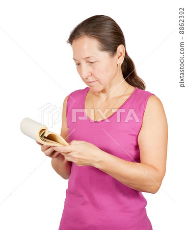 mature woman reads notebook mature woman reads notebook 8862392