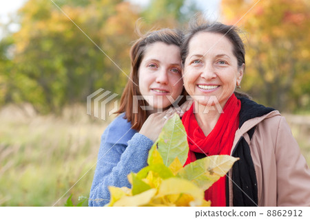 women in autumn garden women in autumn garden 8862912