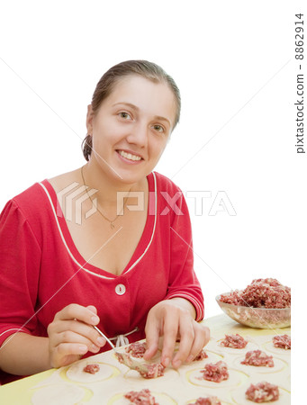 Woman making meat dumplings Woman making meat dumplings 8862914