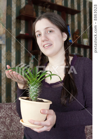 Girl with cactus 8863028