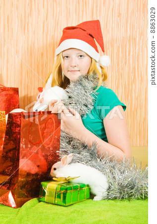 girl with two pet rabbits 8863029