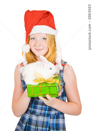girl in santa hat with rabbits girl in santa hat with rabbits 8863083