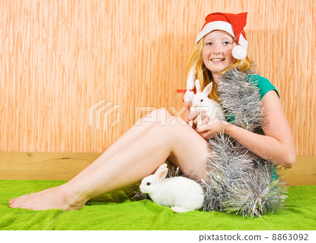 girl in new year decoration with rabbits 8863092