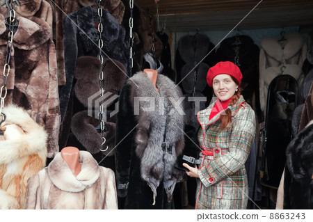 Woman chooses fur coat Woman chooses fur coat 8863243