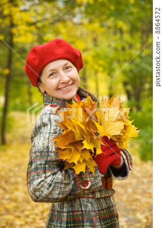 Happy mature woman in autumn Happy mature woman in autumn 8864572