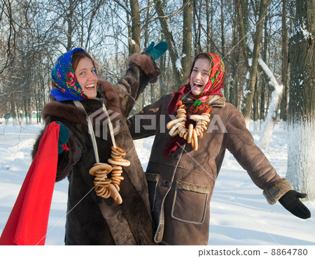 Two girls plays during Pancake Week at Russia 8864780