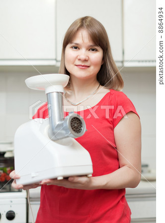 Woman with electric grinder 8864934