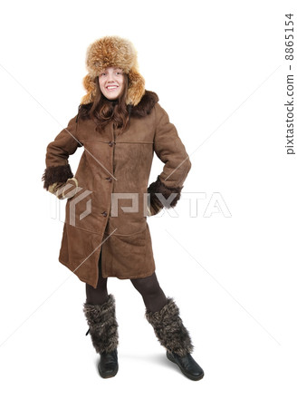 Girl in sheepskin and hat with earflaps Girl in sheepskin and hat with earflaps 8865154
