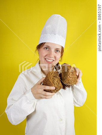 baker is showing fresh bread baker is showing fresh bread 8865197